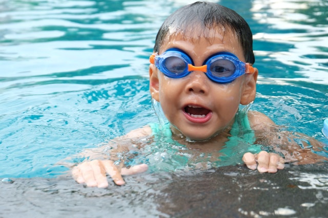 child swimming in the pool