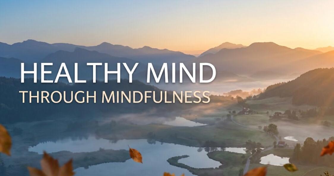 Serene mountain landscape with sunrise and text reading Healthy Mind Through Mindfulness.
